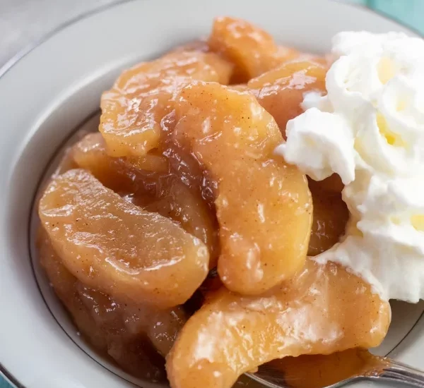 Baked cinnamon apples topped with cream