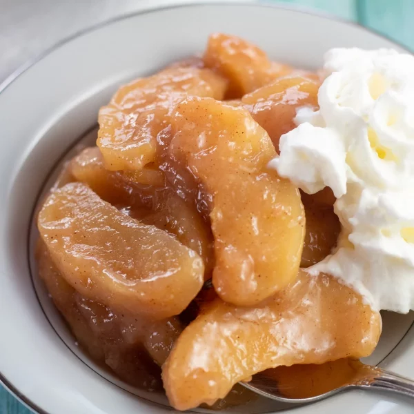 Baked cinnamon apples topped with cream